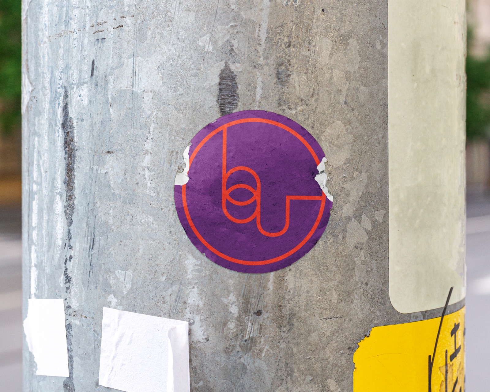 Circular sticker on a weathered pole