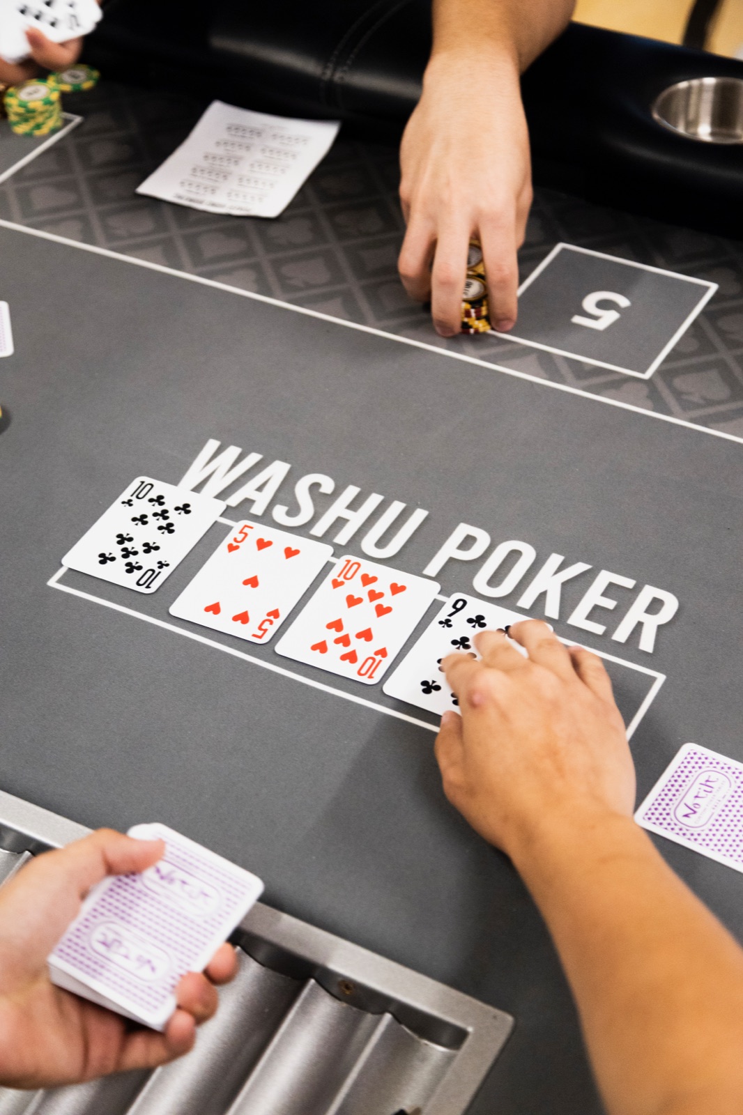 Cards dealt on the WashU Poker felt