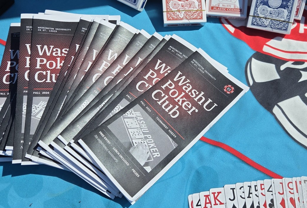 A spread of WashU Poker Club pamphlets and playing cards